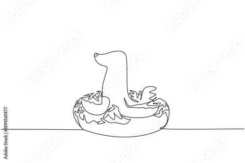 Single line drawing of sea lion shows cute ocean animal sitting inside glazed donut for pastry food concept. Unique design of charming marine mammal for nursery poster purpose in minimalist style art