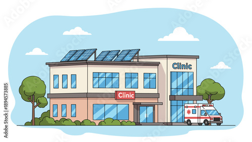 Modern medical clinic building features eco friendly solar panels on the roof with an ambulance waiting in the parking lot.
