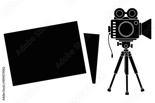 Professional vintage film camera equipment with a retro lens stands on a metal tripod isolated as a classic photography object in a white studio