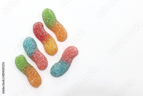 Foto Sugar coated crawler gummy candy, white background