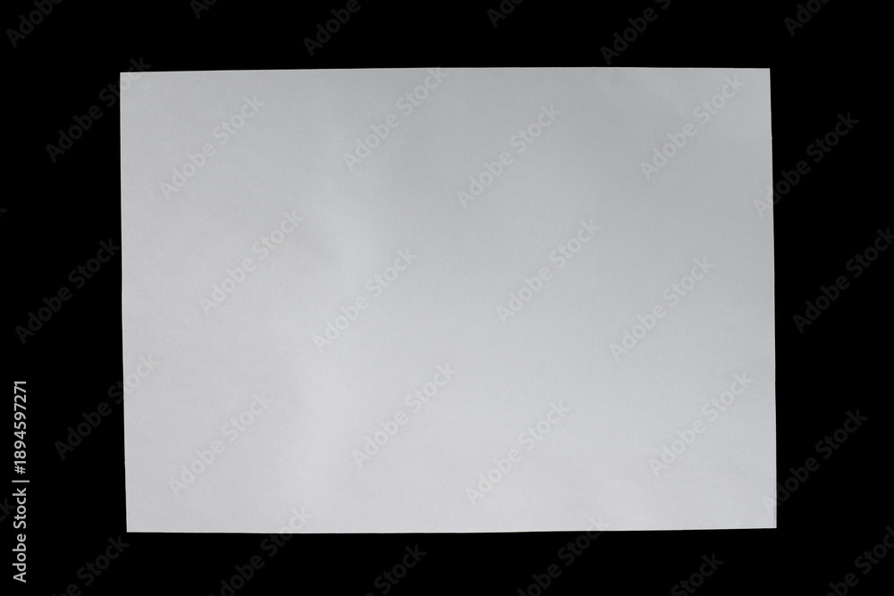 Obraz premium A white A4 sheet of paper on a black background.
