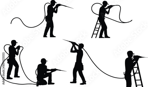 Silhouette construction workers using spray foam insulation equipment with hose and ladder for residential wall cavity energy efficient building work