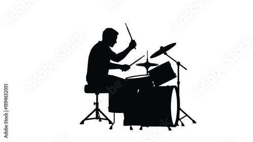 Energetic Silhouette of a Drummer Performing on a Full Drum Kit Representing Musical Passion, Rhythm, and Live Performance