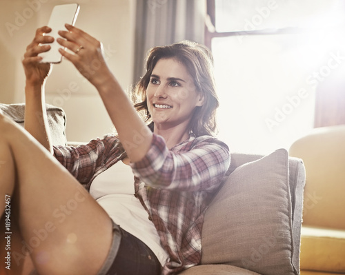 Bild auf Leinwand Selfie, relax and woman with smile on couch, photography and social media update for weekend break