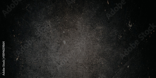 grunge old stained black distressed wall textured image of a dirty surface with scratches and marks on it looking worn out and weathered	