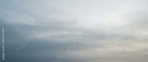 Overcast sky with soft, diffused light and muted grey clouds, creating a calm, atmospheric, and neutral background
