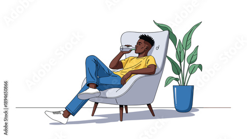 Young African American man relaxes in a modern chair while drinking water from a glass bottle to stay hydrated at home.