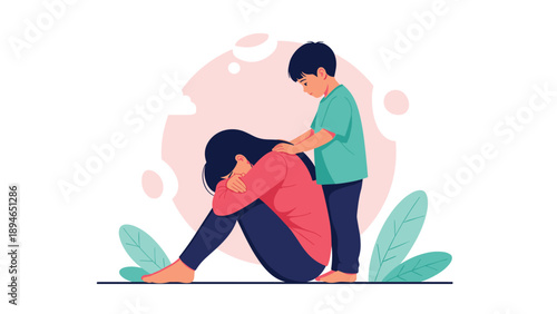 Compassionate young son comforting his sad mother while she sits on the floor crying during a difficult emotional moment.
