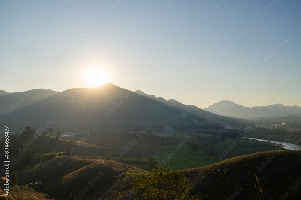 Obraz premium Sunrise over rolling hills nature landscape scenic viewpoint tranquil environment