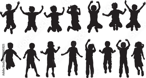 Silhouettes of happy children jumping and playing together outside