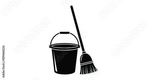 A black silhouette depicts a bucket and broom leaning against a white background illustrating cleaning tools silhouette