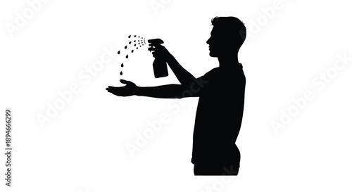 A person spraying a liquid upwards from a bottle showcasing a distinct dark outline silhouette high quality professional