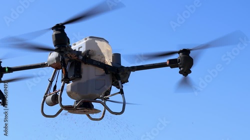 Agricultural Drone, Agricultural drone sowing rice seeds in the air, improving farming efficiency and reducing labor, representing smart farming, modern agriculture, and innovative technology