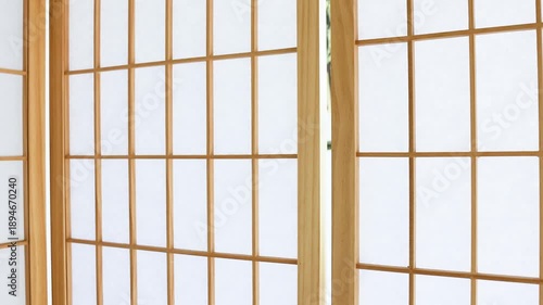 Japanese shoji screen made of wood and white paper. Minimal and calm interior background, perfect for zen, spa, wellness, and interior design concepts