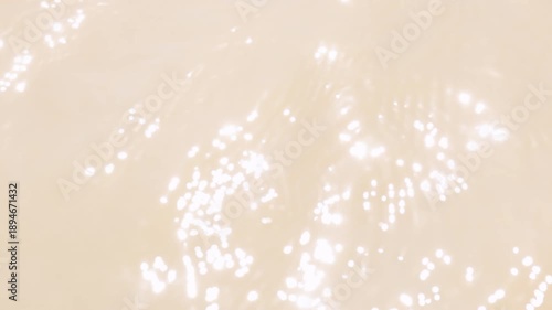 Abstract water light reflection with soft bokeh sparkle. Calm, bright and natural feeling, ideal for background, environmental visuals and motion graphics