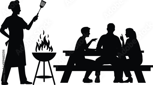 Silhouette of a chef grilling food at a barbecue with a family sitting at a picnic table enjoying the outdoor meal