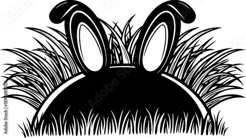 A black rabbit hiding in the grass, viewed from the front, illustrating wildlife in a natural environment.