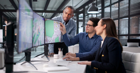 Team Of Diverse Professionals Using GIS