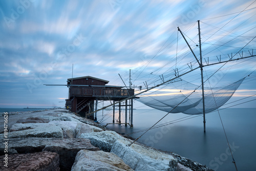 Fishing Nets on Calm Sea at Blue Hour