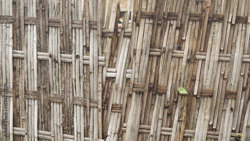 old cement wall background, and dark brown woven bamboo background