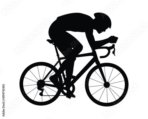 cyclist riding bicycle in motion profile view