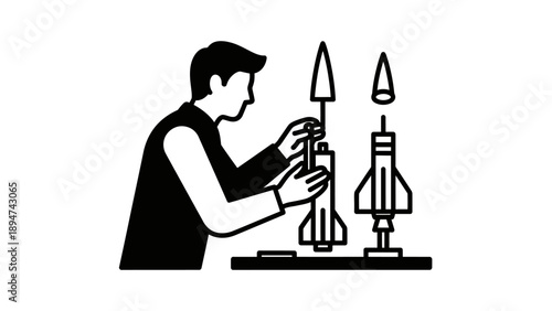Man assembling model rockets on a table.