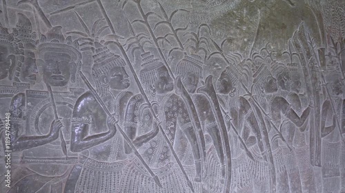 SIEM REAP, CAMBODIA - OCTOBER 27, 2025: Ancient Narrative Bas-Relief Stone Carvings on Angkor Wat Gallery Walls