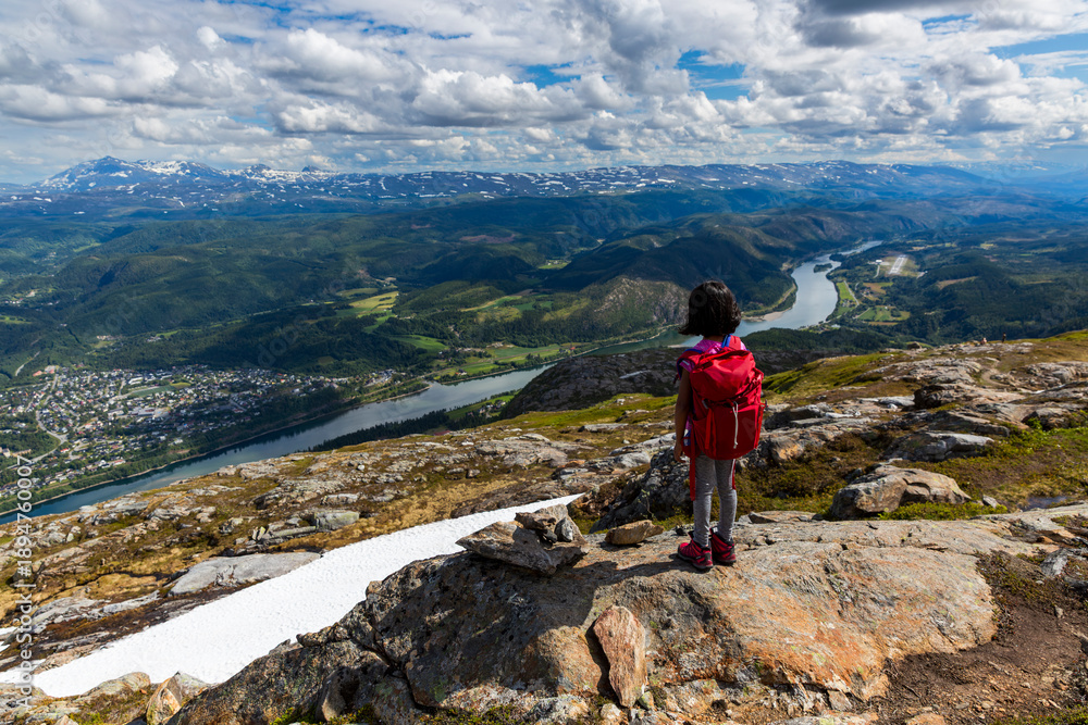 Naklejka premium Child Enjoying River View While Hiking in Helgeland