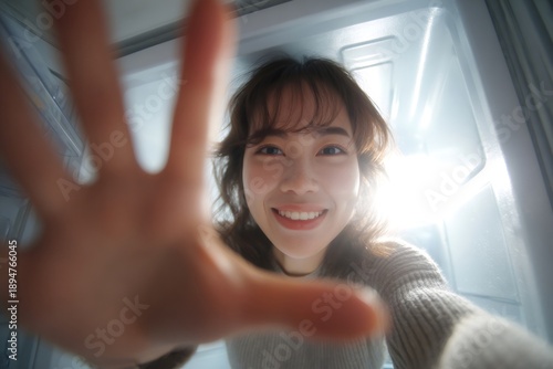 Hungry woman reaching for food inside refrigerator Free Download Hungry woman reaching for food inside refrigerator - GFXLoad