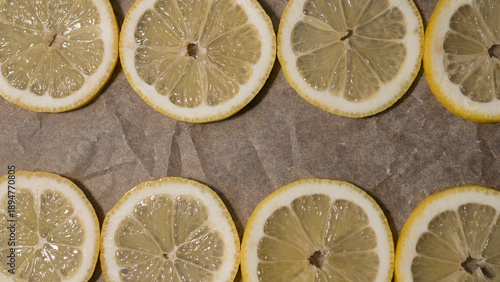 Lemon slices pattern on parchment paper background