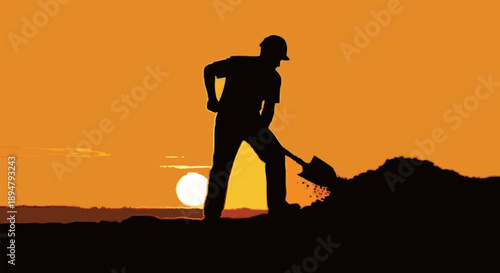 Silhouette of a construction worker digging at sunset.