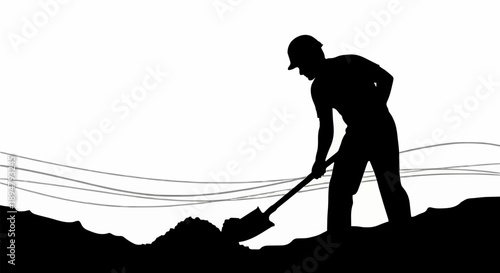 Silhouette of a construction worker digging with a shovel.