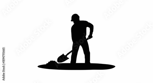 Silhouette of a construction worker digging with a shovel.