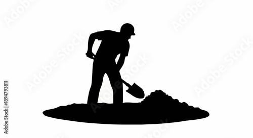 Silhouette of a construction worker digging a hole with a shovel.