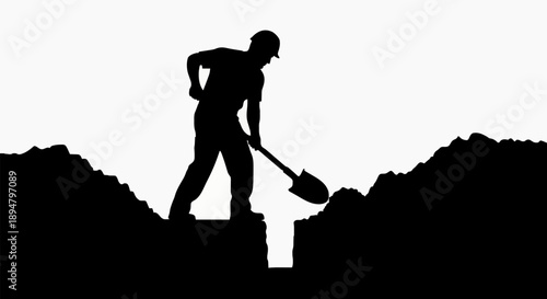 Silhouette of a man digging a trench with a shovel.