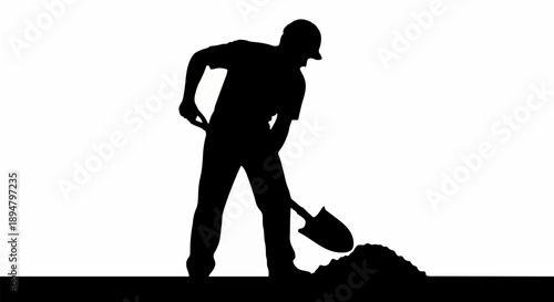 Silhouette of a man digging with a shovel.
