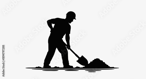 Silhouette of a construction worker digging with a shovel.