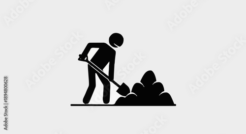 Silhouette of a person digging dirt with a shovel.