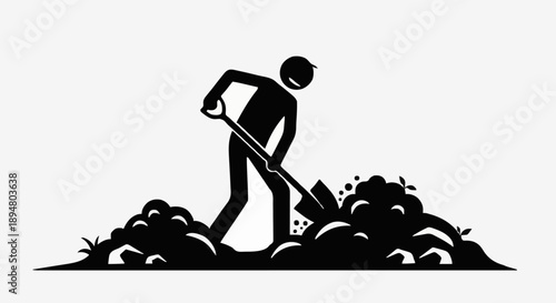 Silhouette of a person digging with a shovel in soil.