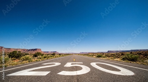Wallpaper Mural Wide angle view of an empty desert highway with number 250 painted on the asphalt road leading to the horizon under blue sky. Torontodigital.ca