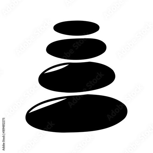 Black stones balanced on top of each other in perfect equilibrium