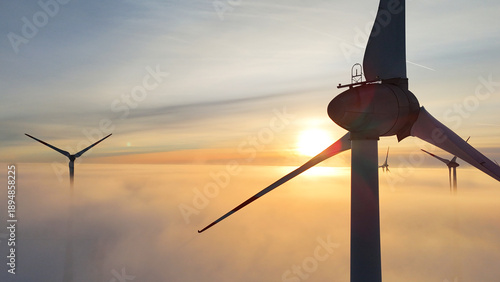 Fotografie Lower Saxony, Germany - January 11, 2026: Wind turbine at sunset during winter t