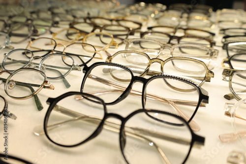 Eyeglasses on table, progressive lenses, eyeglasses for the elderly, glasses progressive lens, eyeglass progressive lens, close-up of glasses on lenses test, looking through glasses