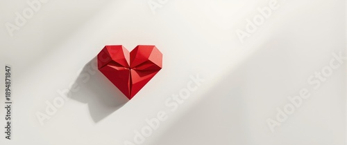 Shadowed paper heart in red polygonal style for invitations