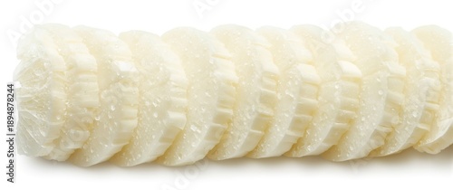 White daikon radish slices (raphanus sativus var. longipinnatus) on white backdrop