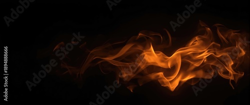 Fire with blurred orange flames on a dark background