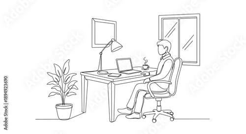 Man working at desk in office with computer and lamp.