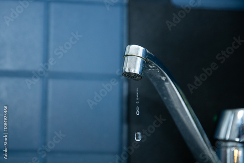 Принти на полотні Leaking faucet with dripping water in modern bathroom