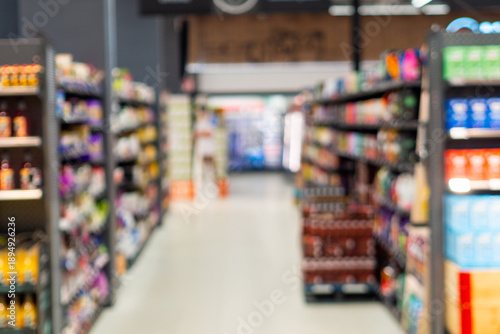 Wallpaper Mural Blurry supermarket aisle with colorful products on shelves Torontodigital.ca