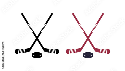 Two crossed hockey sticks with a puck in the center representing the sport of ice hockey and athletic competition